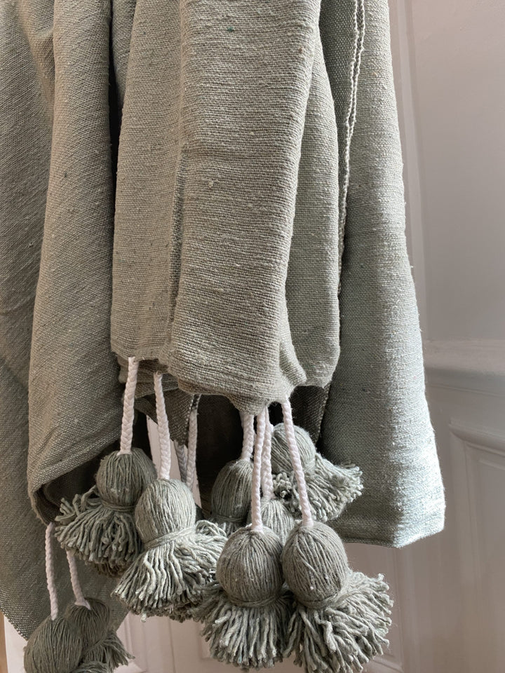 Sage green pompom throw 3/2m